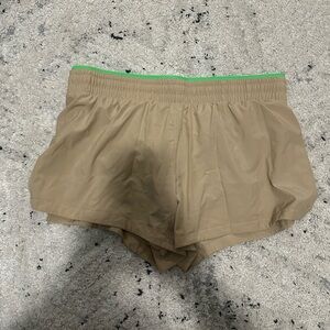 Fabletics Tan Athletic Shorts with Green Trim